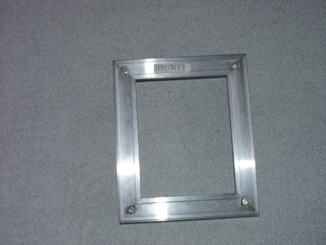 AN ALUMINIUM FRAME FITTING WHICH IS DESIGNED TO CONTAIN AN ENTRANCE MAT. THE FITTING IS DESIGNED TO GO INTO A BUILDING AS A PERMANENT FIXTURE.