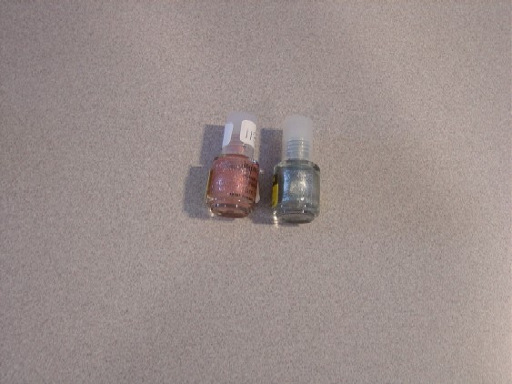 PINK AND GREY GLITTER NAIL VARNISHES. PRESENTED IN 5ml BOTTLE