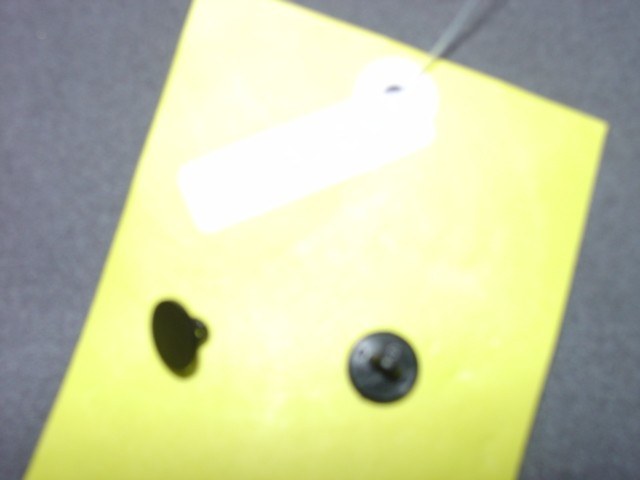 BUTTONS MADE OF POLYESTER. THE BUTTONS ARE PRESSED AND DYED BLACK. DIAMETER IS APPROX 1CM.