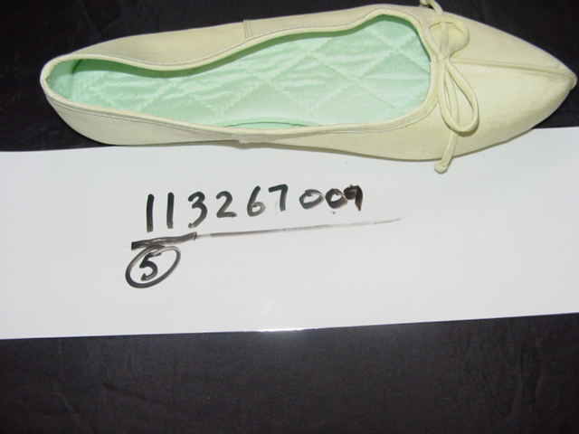 LADIES SLIPPER. UPPERS OF TEXTILE MATERIAL. OUTER SOLES OF LEATHER.(SUEDE) TEXTILE BOW ATTACHED TO VAMP. NOT COVERING THE ANKLE. IN-SOLE LENGTH EXCEEDS 24CMS.