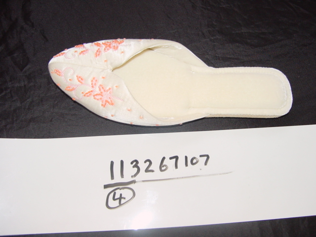 LADIES SLIP ON STYLE SLIPPER. UPPERS OF TEXTILE MATERIAL. OUTER SOLES OF LEATHER.(SUEDE) BEADS ON VAMP. NOT COVERING THE ANKLE. IN-SOLE LENGTH EXCEEDS 24CMS.