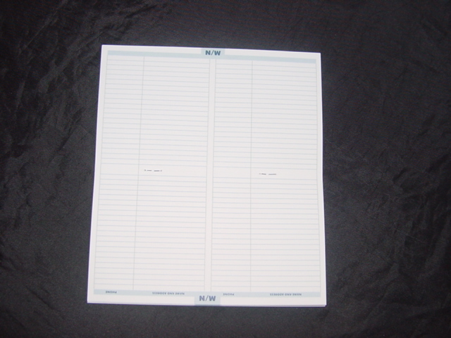 AN ADRESS BOOK. WITH CARD OUTER AND PAPER PAGES. WITH LINED HEADED PAGES. FOLDED AND STAPLED. APPROX 10 X 18 CMS.