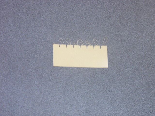 STRING TAGS. CARDBOARD TAG WITH TEXTILE ELASTIC END LOOP.NOT PRINTED. NOT SELF-ADHESIVE. USED FOR MANUFACTURING DISPLAY CARDS. IN VARIOUS COLOURS AND SIZES.