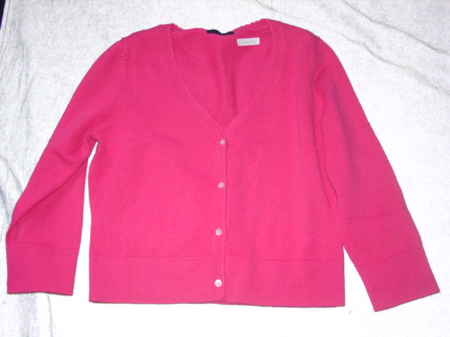 KNITTED CARDIGAN FOR WOMEN.  REACHING DOWN TO BELOW THE WAIST.  V-NECK.  COMPLETE FRONT OPENING FASTENED RIGHT OVER LEFT BY BUTTONS.  LONG SLEEVES.  HEMMED AT SLEEVE ENDS AND AT BASE.  100% KASHMERE