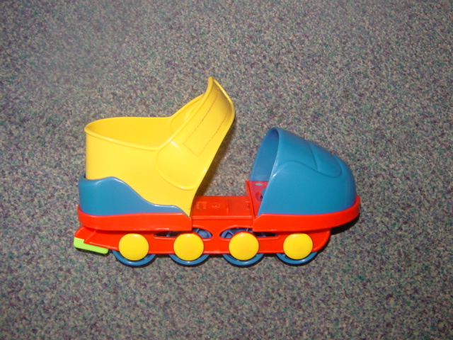 CHILDRENS INLINE ROLLER SKATES. OF MOULDED PLASTIC. WITH 4 MOULDED PLASTIC WHEELS. SKATES ARE ADJUSTABLE BY SLIDING THE TOE AND HEEL SECTIONS AND LOCKING THEM INTO PLACE. DESIGNED TO BE WORN OVER FOOTWEAR. FOR AGES 4-9 YEARS OLD.