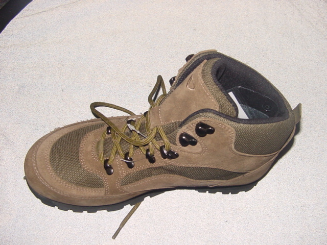 MEN'S OUTDOOR WALKING/HIKING BOOTS. COVERING THE ANKLE BUT NO PART OF THE CALF. LACE UP. UPPERS OF TEXTILE AND LEATHER (SUEDE) - THE LEATHER IS THE PREDOMINANT MATERIAL. IN-SOLES OF A LENGTH 24cm OR MORE. RUBBER HEAVY TREAD OUTER SOLES.