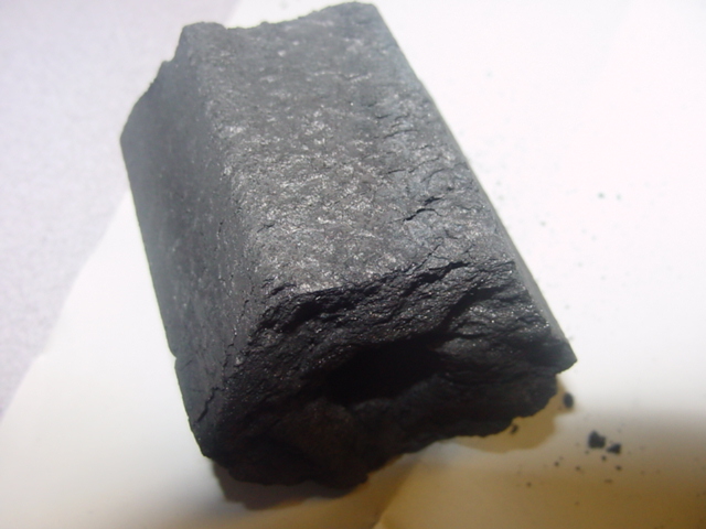 SMOKLESS CHARCOAL BRIQUETTES. MADE FROM AGGLOMERATED WOOD WASTE WITHOUT A BINDING AGENT. HEXAGONAL IN SHAPE WITH A HOLE THROUGH THE MIDDLE. FOR BARBEQUE USE.