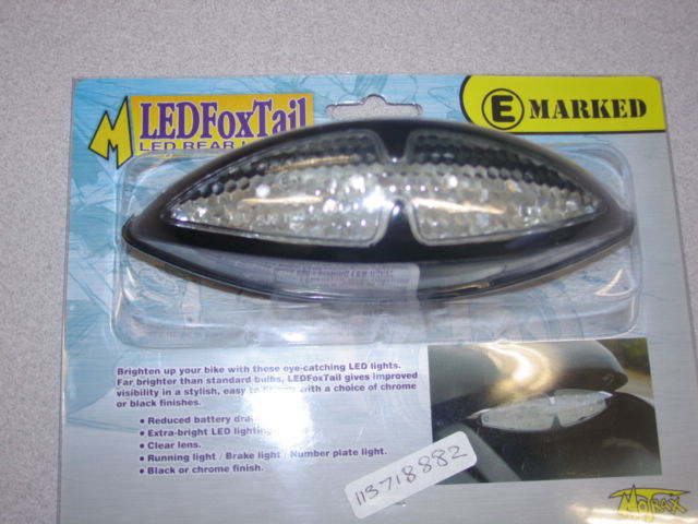 LED LIGHT. TO BE USED ON A MOTOR BIKE. CLEAR LENS. 15CM LONG 4CM WIDE APPROX. PACKAGED IN A BLISTER PACK