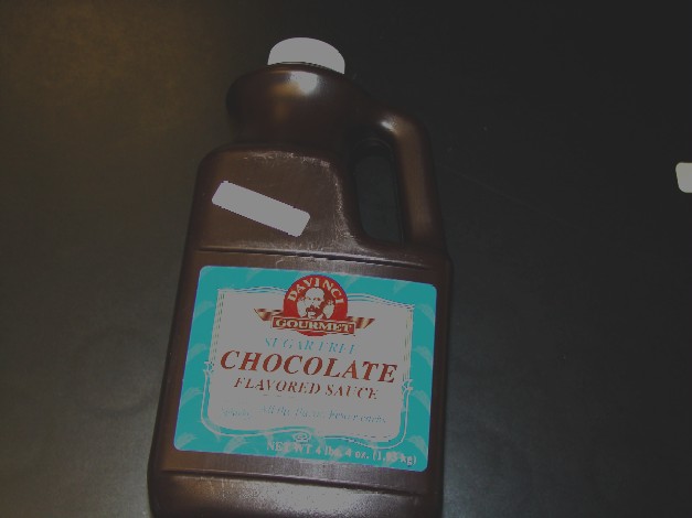 CHOCOLATE FLAVOURED SAUCE.PACKAGED IN A PLASTIC BOTTLE. IN A NET WEIGHT OF 4lbs 4oz.
INGREDIENTS INCLUDE WATER, MALITOL SYRUP, NATURAL COCOA (5-10%), XANTHAM GUM, LACTIC ACID, MODIFIED CORN STARCH, SALT, NATURAL FLAVOR, SODIUM BENZOATE, SUCRALOSE, POTASSIUM SORBATE.