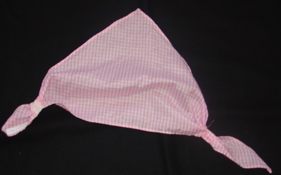 A WOVEN GINGHAM NECKERCHIEF/ CRAVAT OF COTTON. TRIANGULAR SHAPED GATHERED AT TWO POINTS, WITH VELCRO FASTENING AT NECK. HEMMED ON ALL EDGES.  PRESENTED WITH A HAT, WAISTCOAT AND SKIRT AS PART OF A COW GIRL FANCY DRESS OUTFIT.