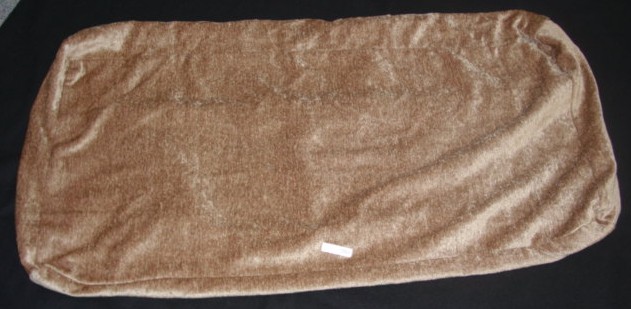 A WOVEN SEAT COVER MEASURING 81 CMS. IN LENGTH X 40 CMS. HIGH X 10 CMS. IN DEPTH APPROX.  WITH A ZIP FASTENER FOR INSERTING SEAT PAD.  68% RAYON.  32% COTTON.