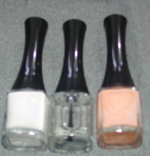 A SET OF THREE NAIL POLISHES WHICH HAVE BEEN PACKAGED IN A TRANSPARENT ACETATE BOX WITH A TEXTILE BAG WHICH HAS BEEN CLASSIFIED SEPARATELY UNDER 114021439.