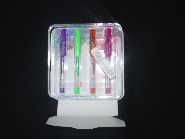 A SET OF 4 DIFFERENT COLOURED GEL PENS, A SMALL NOTE PAD AND PRINTED STICKERS. PRESENTED IN A MOULDED PLASTIC TRAY AND CARD INSERT. PACKED IN A PLASTIC CONTAINER/BAG FASTENED BY ZIP CLASSIFIED SEPARATELY.