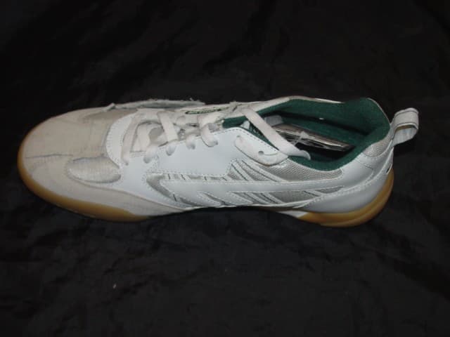 UNISEX SQUASH SHOE. NOT COVERING THE ANKLE. UPPERS CONSISTING OF PLASTIC, TEXTILE AND LEATHER MATERIALS OF WHICH THE PLASTIC PREDOMINATES. OUTER SOLES OF PLASTIC/RUBBER. SPECIAL TECHNOLOGY SOLE DESIGNED TO ABSORB IMPACT OF LATERAL OR VERTICAL MOVEMENTS. LOGO ON TONGUE AND HEEL. LACE UP SHOES. INSOLE LENGTH EXCEEDS 24 CMS. CIF PRICE LESS THAN 9 EURO.