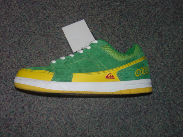 MENS TRAINING SHOE. NOT COVERING THE ANKLE. UPPERS OF LEATHER, PLASTIC AND TEXTILE MATERIAL. LEATHER PREDOMINATES. OUTER SOLES OF RUBBER. WITH LOGO ON UPPER AND TONGUE. LACE UPS. INSOLE LENGTH EXCEEDING 24 CMS. NO VISIBLE EVIDENCE OF ANY SPECIAL TECHNOLOGY FEATURES. GREEN AND YELLOW IN COLOUR.