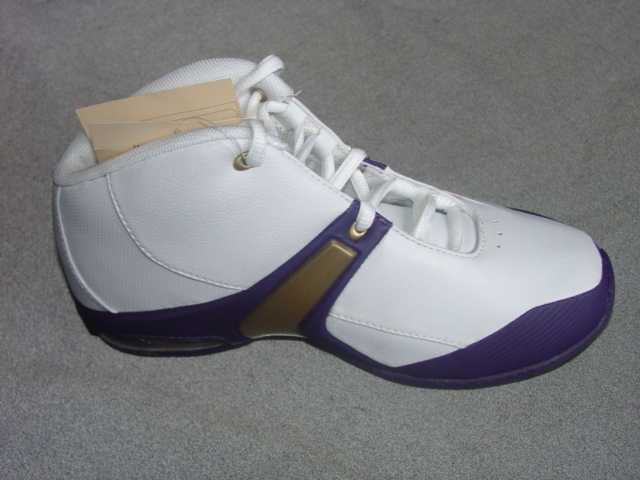 CHILDS TRAINER STYLE BOOT. COVERING THE ANKLE BUT NO PART OF THE CALF. UPPERS OF PLASTIC. OUTER SOLES OF PLASTIC. WITH LOGO ON THE HEEL, TONGUE AND SIDE OF THE SHOE. LACE FASTENING. SPECIAL TECHNOLOGY IN THE HEEL, IN THE FORM OF A GAS PAD AND AN EVA MIDSOLE TO ABSORB THE IMPACT OF VERTICAL OR LATERAL MOVEMENT. INSOLE LENGTH MEASURING LESS THAN 24 CMS. WHITE/NAVY IN COLOUR. CIF PRICE EXCEEDING EURO9.