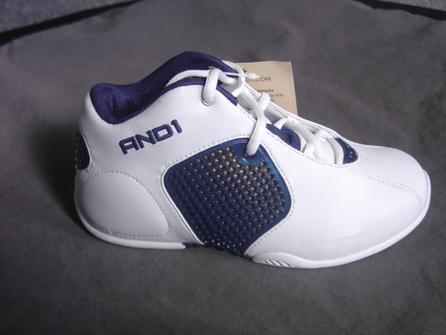 CHILDS TRAINER STYLE BASKETBALL BOOT. COVERING THE ANKLE BUT NO PART OF THE CALF. UPPERS OF PLASTIC. OUTER SOLES OF PLASTIC. WITH LOGO ON THE HEEL, TONGUE AND SIDE OF THE SHOE. LACE FASTENING. SPECIAL TECHNOLOGY IN THE SOLE IN THE FORM OF AN EVA MIDSOLE TO ABSORB THE IMPACT OF VERTICAL OR LATERAL MOVEMENT. INSOLE LENGTH MEASURING LESS THAN 24 CMS. WHITE AND NAVY IN COLOUR. CIF PRICE EXCEEDING EURO9.