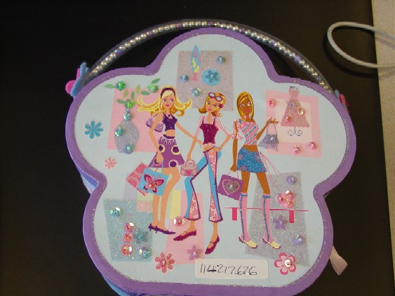 Childrens cosmetic set. Consists of a body spray, eye shadow,  blush, sponge applicator, brush applicator, nail polish and two buttons.  The items are put up for retail sale packed inside a flower shaped cosmetic case with lid (a mirror is attached to the inside of the lid) , decorative handle and metal catch. The cosmetic case has been classified separately.