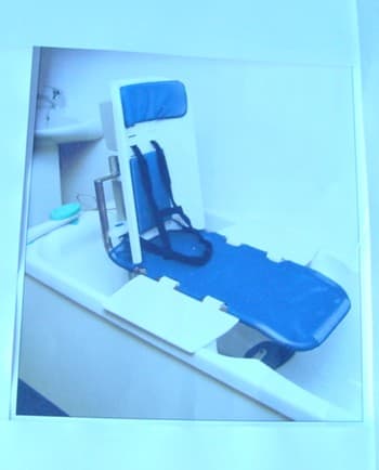 A LIGHT WEIGHT PORTABLE BATH SEAT THAT WILL LOWER AND RAISE A CHILD IN AND OUT OF A BATH,IT REDUCES THE NEED FOR HANDLING BY CARERS. IT IS MADE IN TWO EASILY CONNECTED SECTIONS WITH A FOLD UP STORAGE FACILITY. IT IS SUPPLIED WITH A LOW PELVIC STRAP. PADDED HARNESS AND LOW VOLTAGE RECHARGEABLE BATTERY AND CHARGING UNIT.THE CHARGED BATTERY ALLOWS FOR NOT LESS THAN TEN LIFTS. DIMENSIONS. 660MM LONG BY 560MM LONG BY 350MM WIDE AND BATH SEAT AND FRAME WEIGH 12KGS