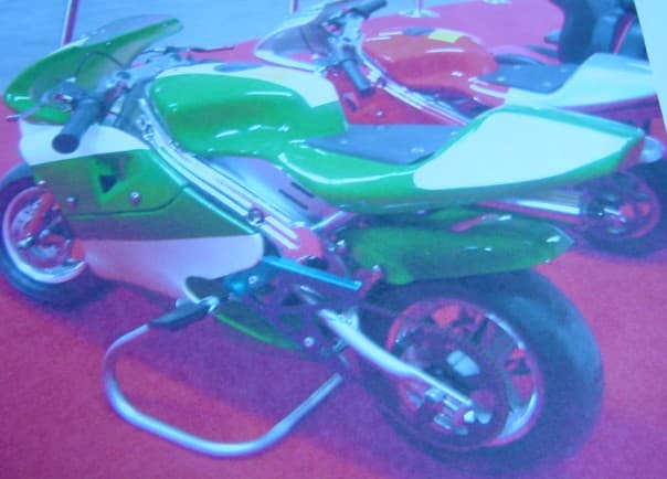 A 49CC PETROL MINI MOTORBIKE.  VARIOUS COLOURS.