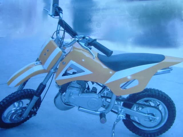 A 50CC PETROL DIRT BIKE.  COLOUR: YELLOW AND WHITE.