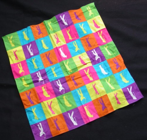 A SQUARE WOVEN HANDKERCHIEF MEASURING 42 CMS. X 45 CMS. APPROX.  VARIOUS  DESIGNS.  OF COTTON.  PACKAGED IN A RING-PULL TIN CAN FOR RETAIL SALE.