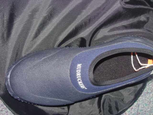 WATERPROOF SHOES. UPPERS OF RUBBER NOT COVERING THE ANKLE.  SLIP ON STYLE.  INJECTION MOULDED SOLE THAT IS NOT ASSEMBLED OR ATTACHED TO THE UPPERS BY MEANS OF STITCHING, RIVETING, NAILING, SCREWING, PLUGGING OR SIMILAR PROCESSES.  INSOLE MEASUREMENT EXCEEDS 24CM. NEOPRENE AROUND THE TOP OF THE SHOE.