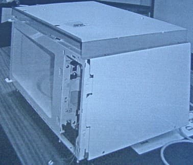 A DOMESTIC MICROWAVE OVEN.  THE SUB ASSEMBLY WHICH INCORPORATES THE MICROWAVE GENERATOR AND ALL OTHER INTERNAL COMPONENT AS WELL AS THE ELECTRICAL CABLE AND PLUGS. IT DOES NOT INCLUDE THE CONTROL PANEL, DOOR, TURNTABLE AND FRONT FASCIA AS IT IS DESIGNED AS A 'BUILT IN TYPE' DOMESTIC MICROWAVE OVEN.