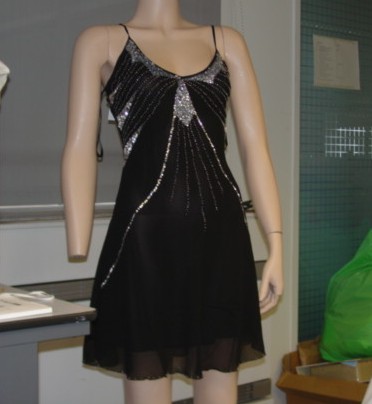 A WOVEN CHIFFON DRESS FOR LADIES. DESIGNED TO COVER THE BODY FROM THE SHOULDERS TO JUST ABOVE THE KNEE. WITH ADJUSTABLE SHOULDER STRAPS. WITHOUT SLEEVES. WITH V-NECK. WITH BEADED AND SEQUIN DECORATION AROUND FRONT AND BASE OF GARMENT. WITH INNER LINING. MADE FROM SILK. PACKAGED IN A CLEAR PLASTIC BAG.