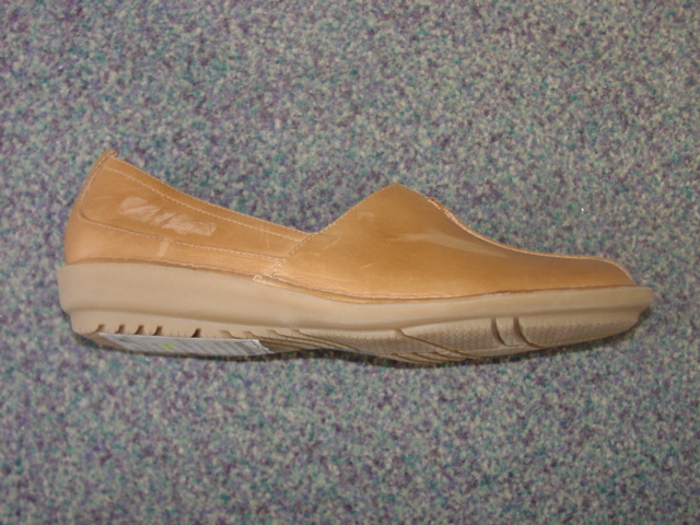 LADIES SLIP ON STYLE SHOE. NOT COVERING THE ANKLE. UPPERS OF LEATHER. OUTER SOLES OF RUBBER. INSOLE LENGTH EXCEEDING 24CMS. BEIGE IN COLOUR.