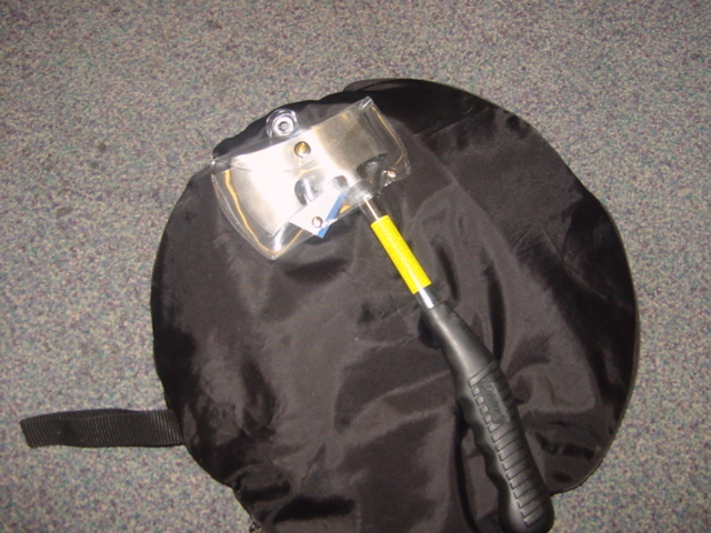 OUTDOOR AXE. MADE OF STEEL WITH A RUBBER HANDLE.  PACKAGED WITH HEADER CARD SWING TICKET AND A PVC POUCH ENCOMPASSING THE HEAD OF THE AXE.