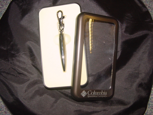 BALL POINT PEN ON A KEY RING. HARD TITANIUM COATED METAL CASING. THE PEN IS APPROX 7CM. IN LENGTH. SECURE LOBSTER CLAW CLIP. PACKAGED FOR RETAIL SALE.