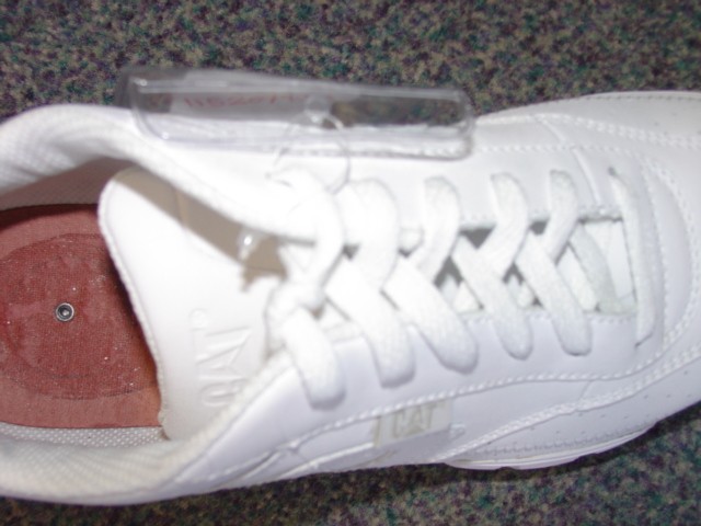 UNISEX TRAINER STYLE SHOE. NOT COVERING THE ANKLE. UPPERS OF LEATHER. OUTER SOLES OF SYNTHETIC MATERIALS. WITH LOGO ON THE TONGUE AND SIDE, HEEL OF THE SHOE. LACE - UPS. INSOLE LENGTH MORE THAN 24CMS. NO SPECIAL TECHNOLOGY FEATURES.