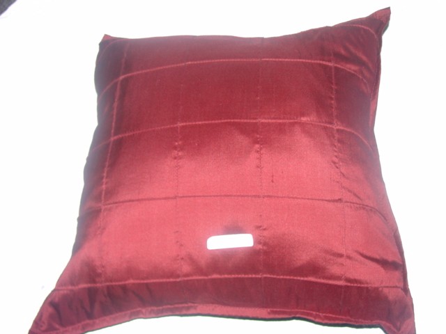 STUFFED CUSHION. CUSHION COVER IS MADE OF 100 PER CENT SILK. INNER IS FILLED WITH DUCK FEATHERS AND DOWN, WHICH IS CONTAINED WITHIN A 100 PER CENT COTTON COVER. CUSHION COVER HAS A ZIP.