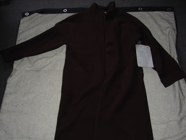 A KNITTED OVERCOAT FOR UNISEX. DESIGNED TO COVER THE WHOLE OF THE BODY FROM THE SHOULDERS REACHING DOWN TO BELOW THE KNEE. WITH REVER COLLAR. WITH LONG SLEEVES WITH TURN BACK CUFFS. WITH COMPLETE OPENING. WITH TWO SIDE POCKETS. UNLINED. OVERLOCKED AT EDGES. GARMENT IS MADE FROM 100 PER CENT BOILED WOOL.