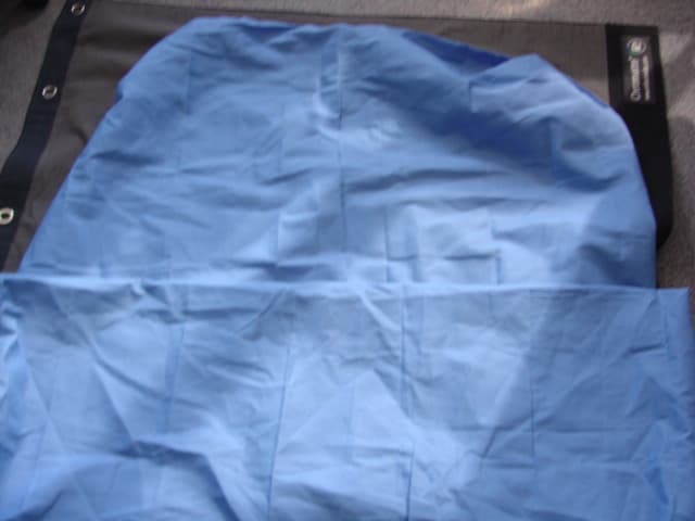 A WOVEN MATTRESS COVER. DESIGNED TO FIT OVER THE MATTRESS FOR PROTECTION. WITH BOXED SHAPED SEAMS AT THE CORNER TO FIT A STANDARD MATTRESS. WITH A FULL OPENING AT ONE END WITH POPPERS. 80 PER CENT POLYESTER, 20 PER CENT COTTON.