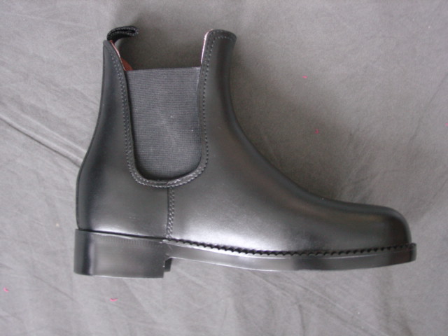 PVC PLASTIC SLUSH MOULDED TALL BOOT. COVERS THE LOWER LEG UP TO THE KNEE.  LINED WITH TEXTILE.  BLACK.