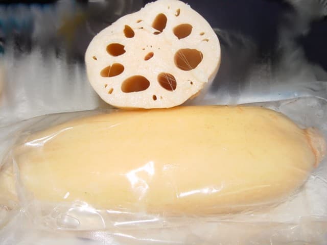 LOTUS ROOTS ARE TUBEROUS ROOTS OF THE WATER LILY FAMILY NYMPHAEACEAE. THE SKIN IS SMOOTH AND ON THE INSIDE SEVERAL LARGE AIRPOCKETS RUN THE LENGTH OF THE ROOT.