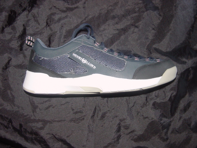 UNISEX TRAINING SHOE. NOT COVERING THE ANKLE. WITH UPPERS OF PLASTIC AND TEXTILE WHERE THE PLASTIC PREDOMINATES. OUTER SOLES OF RUBBER. WITH EVA MIDSOLE WHICH IS DESIGNED TO ABSORB THE IMPACT OF VERTICAL AND LATERIAL MOVEMENTS. LACE UP FASTENING. LOGO ON TONGUE AND UPPER. BLUE AND WHITE IN COLOUR. EXCEEDING EURO 9 PER PAIR.