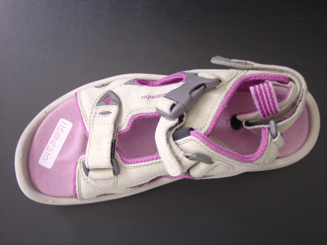 UNISEX SANDAL. NOT COVERING THE ANKLE. UPPERS OF  LEATHER, WITH A TEXTILE LINING. CONSISTS OF TWO HALVES WHICH ARE FASTENED TOGETHER BY THREE VELCRO STRAPS. TWO STRAPS ACROSS THE VAMP AND ONE AROUND THE BACK OF THE HEEL. OUTER SOLE OF RUBBER. INOLE LENGTH OF 24CMS. SOLE AND HEEL COMBINED HAVING A HEIGHT OF 3CMS.