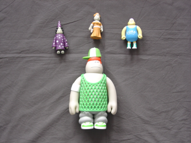 PLASTIC TOY FIGURES OF HUMAN CHARICATURE TYPE. EACH HAS THE PHYSICAL CHARACTERISTICS OF HUMANS OF STANDING UPRIGHT ON TWO LEGS, TWO ARMS AND HANDS, HEAD WITH TWO EYES AND MOUTH. PRESENTED IN A PLASTIC TRAY IN A CARDBOARD BOX  FOR RETAIL SALE.