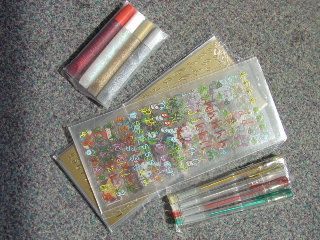 CRAFT SET CONTAINING SHEETS OF STICKERS, FOUR COLOURED BALL POINT PENS WITH GEL INK AND FOUR DIFFERENT COLOURED GLITTER GLUES. PACKAGED TOGETHER FOR RETAIL SALE.