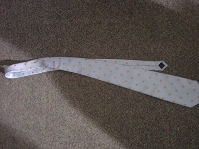 A WOVEN NECK TIE. 100 PER CENT POLYESTER.