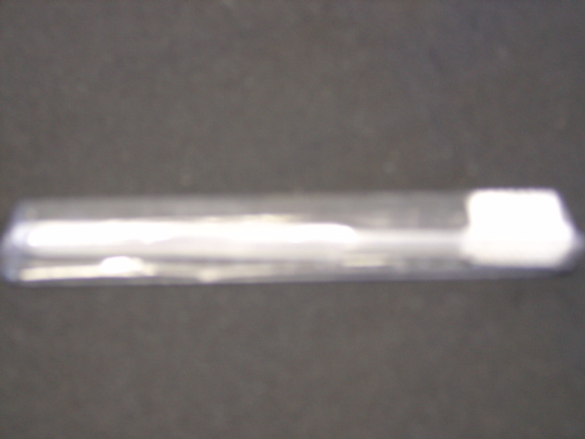 A PLASTIC TOOTHBRUSH.  PACKAGED IN A BLISTER PACK. PACKAGED IN A TEXTILE TOILET BAG CONTAINING SOCKS EYE MASK AND VARIOUS TOILETRY ITEMS WHICH HAVE BEEN CLASSIFIED SEPARATELY.