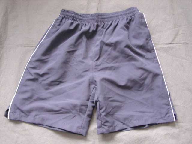 WOVEN SWIMSHORTS FOR MEN.  ELASTICATED WAIST WITHOUT OPENING.  WITH DRAWSTRING.  WITH INNER MESH BRIEF LINING.  WITH FULLY ZIPPED HIP POCKETS.  HEMMED AT LEG ENDS.  100 PERCENT POLYESTER.  PACKED IN A PLASTIC BAG.