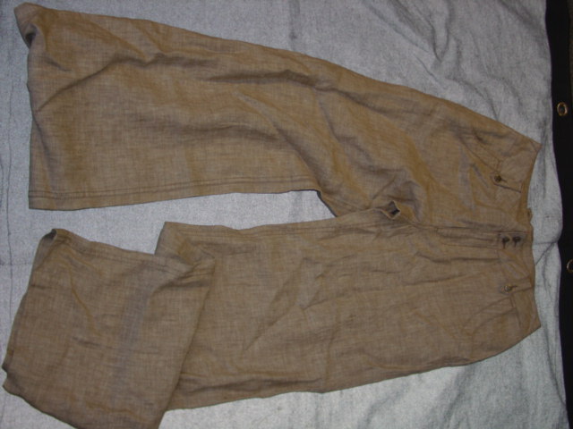 WOVEN TROUSERS FOR WOMEN.  REACHING DOWN TO THE ANKLES. PARTIAL FRONT OPENING FASTENED BY ZIP AND BUTTONS.  WITH BELT LOOPS.  WITH POCKETS.  HEMMED AT LEG ENDS. 100 PERCENT LINEN
