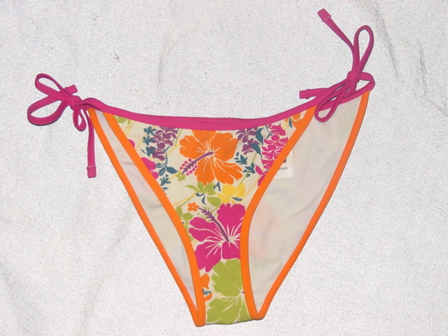 A KNITTED BIKINI BRIEF DESIGNED TO COVER THE LOWER PART OF THE BODY FROM THE HIPS TO THE CROTCH. WITH A HIGH CUT LEGS.  LINED. WITH LINED GUSSET. WITH TIES EACH SIDE. OF MULTI COLOURED FLORAL PRINT. OF 90 PER CENT COTTON 10 PERCENT ELASTANE. WITH NYLON/ELASTANE TRIM.