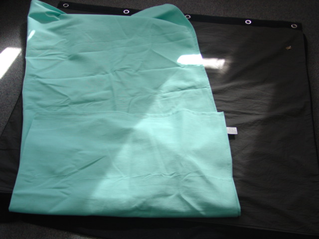 A WOVEN COTTON BEDSPREAD. MEASURING 150 X 200 CMS. HEMMED ON ALL EDGES. PLAIN DIED. NOT PADDED OR QUILTED.