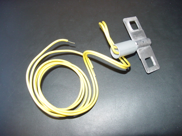 A MULTI PURPOSE  ELECTRO THERMAL LINK   COMPRISING OF ALUMINIUM, ELECTRICAL WIRE, FUSE AND SOLDER.  IT IS A DUAL RESPONSIVE FUSIBLE LINK RELEASE DEVICE WHERE THE LINK HALVES WILL SEPARATE EITHER WHEN THE AMBIENT TEMPERATURE NEARS THE RATED TEMPERATURE CAUSING THE LOW TEMPERATURE ALLOY TO MELT OR WHEN A 0.2 AMPERE MINIMUM TRIP CURRENT IS APPLIED WITHIN A VOLTAGE RANGE OF 6-30 VAC/DC FOR 50 MILLISECOND MINIMUM DURATION CAUSING AN IRREVERSIBLE CHEMICAL REACTION THAT MELTS THE ALLOY.  THE DEVICE IS DESIGNED FOR RESPONSE IN BUILDINGS TO FIRE, SMOKE, INFRARED AND LIGHT DETECTORS.