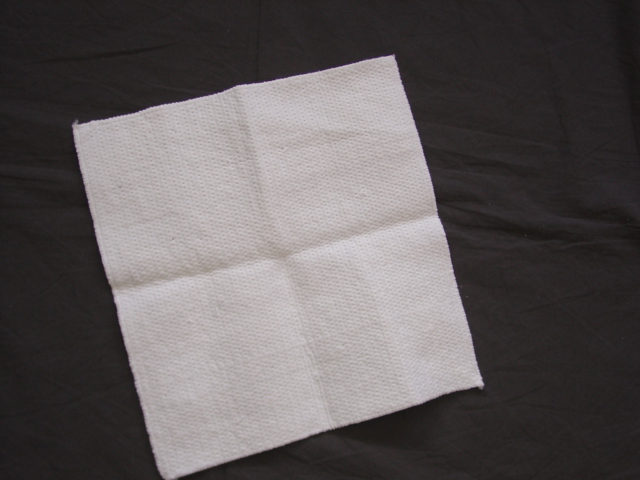 A HOUSEHOLD MICROFIBRE CLEANING CLOTH OF 70 PERECENT COTTON AND 30 PERCENT SYNTHETIC FIBRES. MEASURING 30 X 30 CMS. CONSTRUCTED OF A LAYER OF NON-WOVEN STITCHED TO A LAYER OF WADDING, WITH OVERLOCKED EDGES.